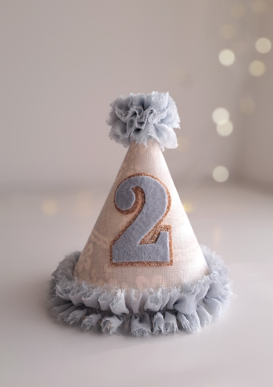Party hat with number 2 on a light background.