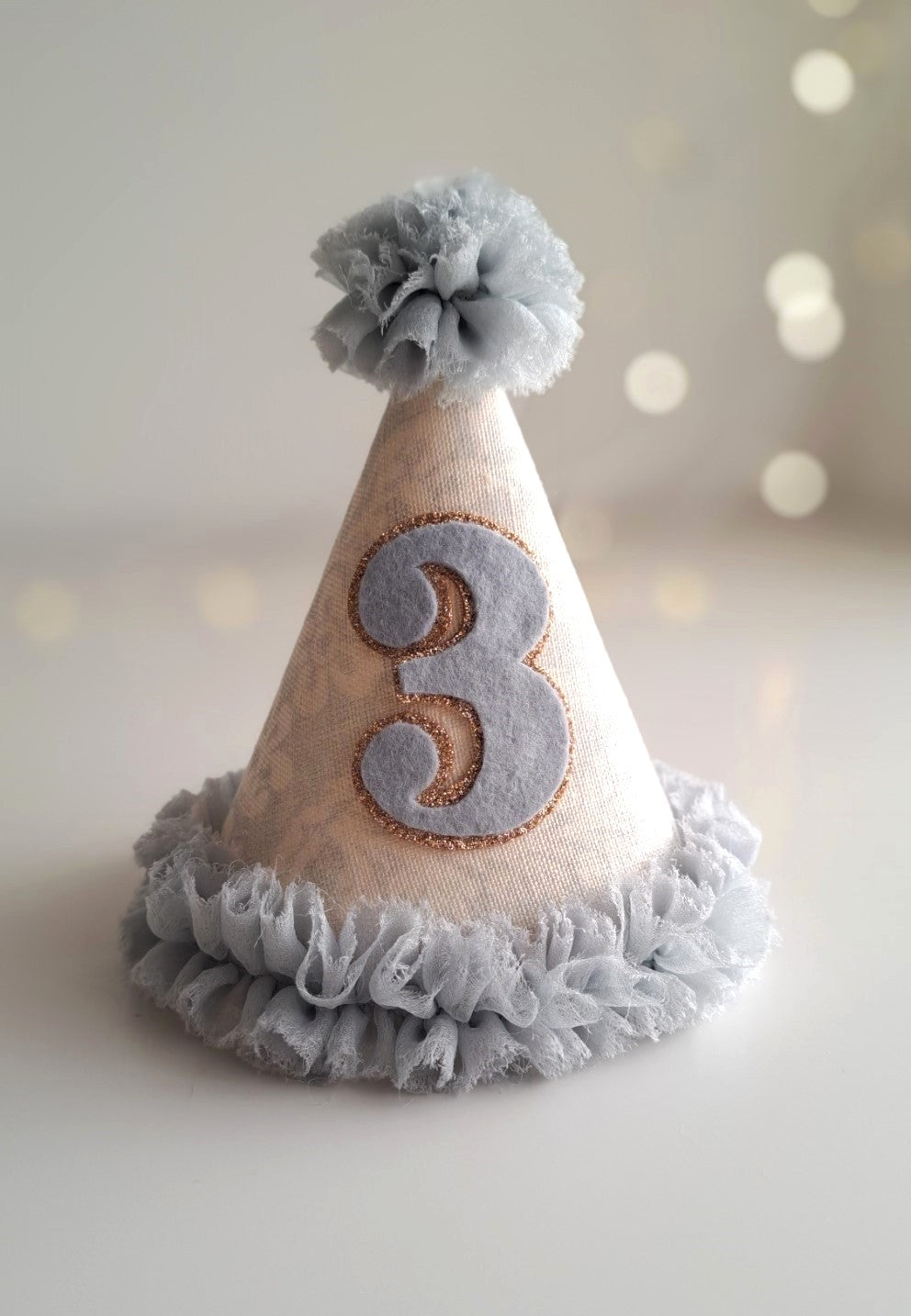Party hat with number 3 on a light background.