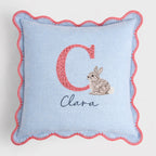 Decorative pillow with letter , rabbit illustration, and name on a light blue background -  personalised baby / toddler gift.