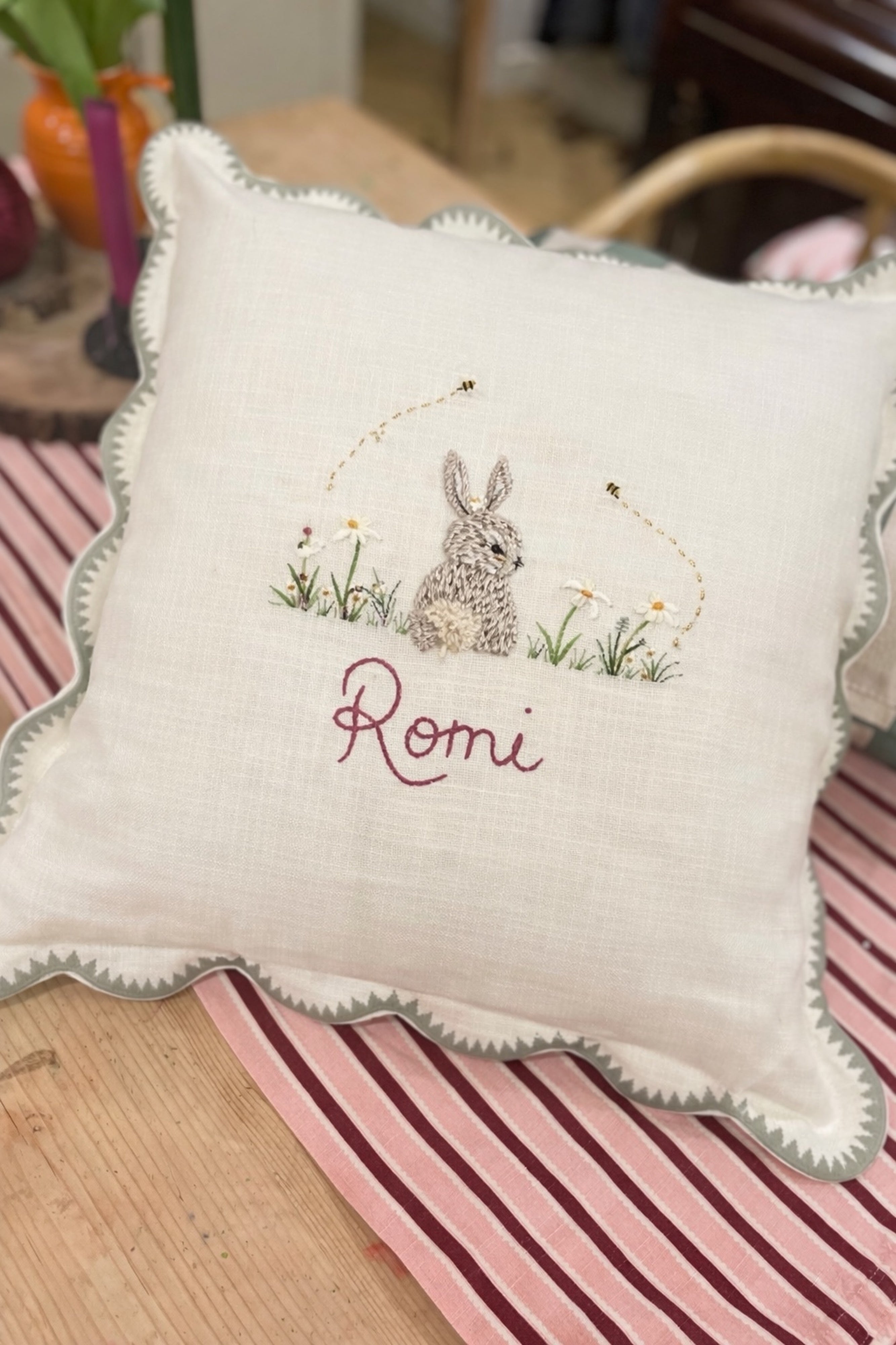 Decorative pillow with embroidered rabbit and  text on a striped fabric background -  personalised baby / toddler gift.