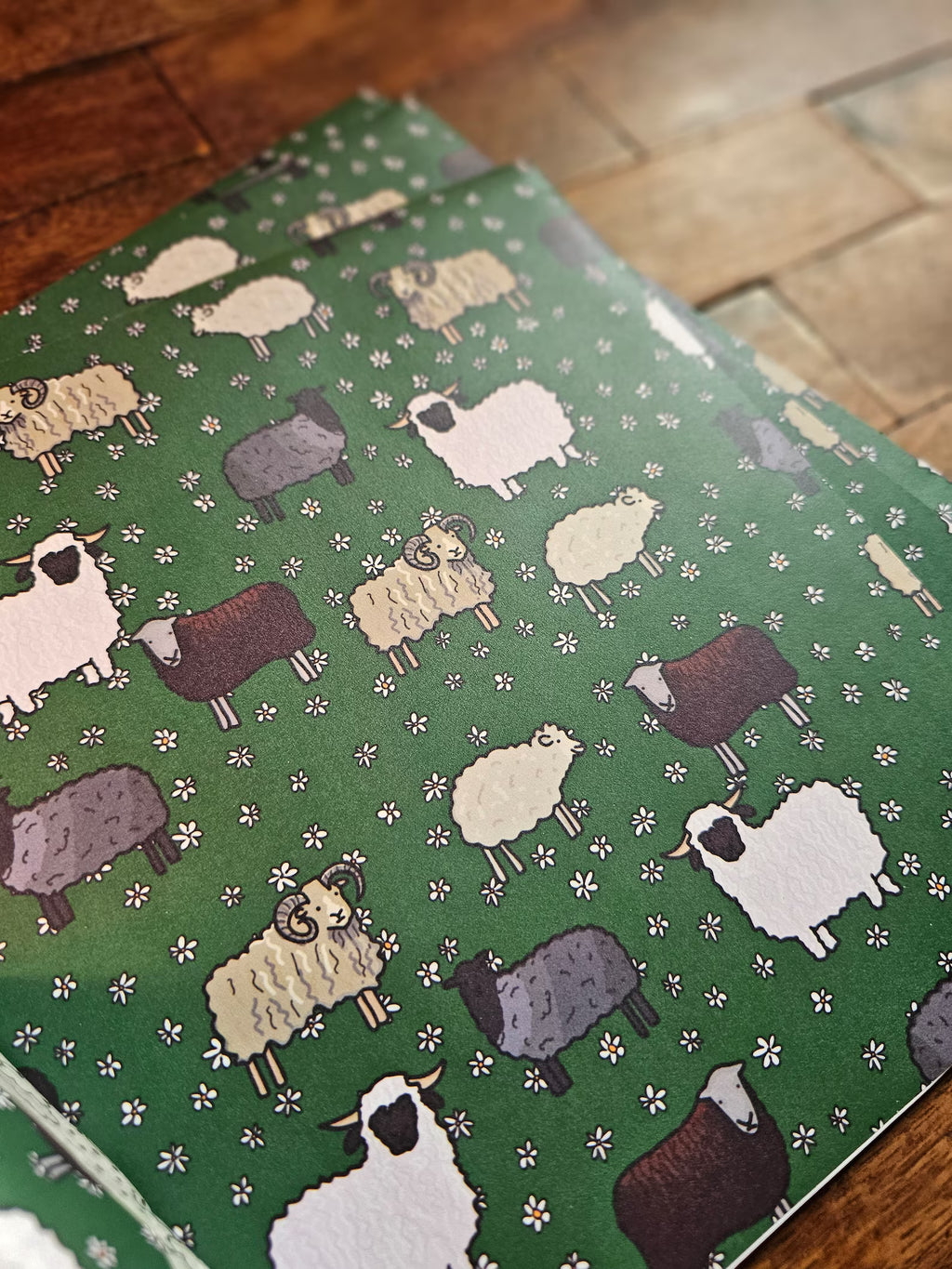 Sheep-patterned fabric on a wooden surface