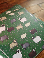 Sheep-patterned fabric on a wooden surface