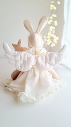 Baby outfit with bunny ears and white wings on a light background- heirloom baby/toddler gifts.