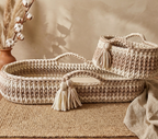 Set of woven baskets with tassels on a neutral background